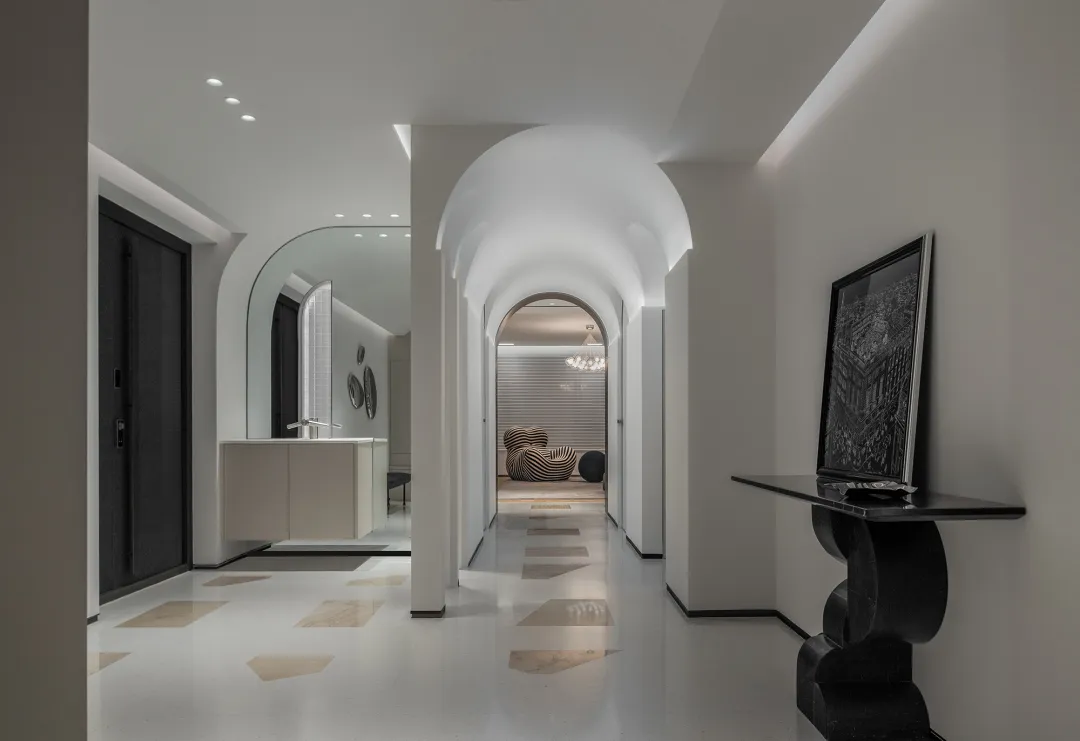 Modern entrance hall with stucco walls and marble flooring