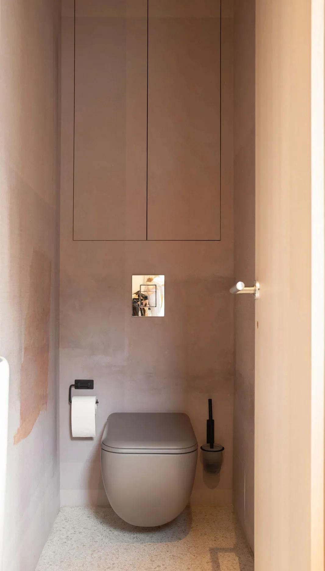 A modern bathroom featuring a concrete floor.
