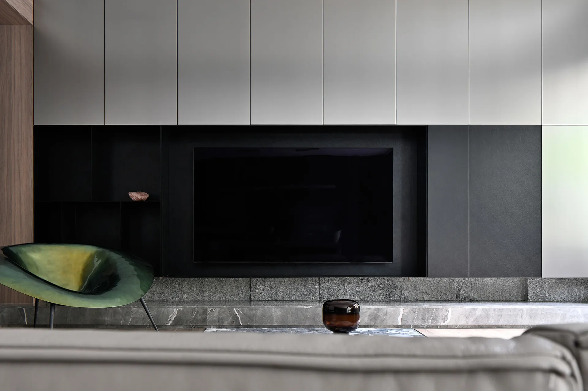 Modern living room featuring marble flooring and minimalist design.