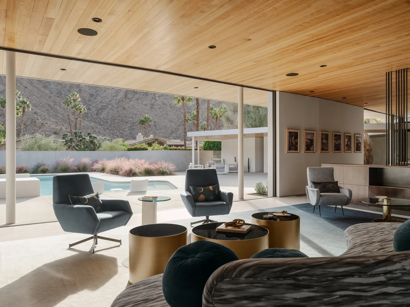 Modern living room featuring metal, glass, and wood materials.
