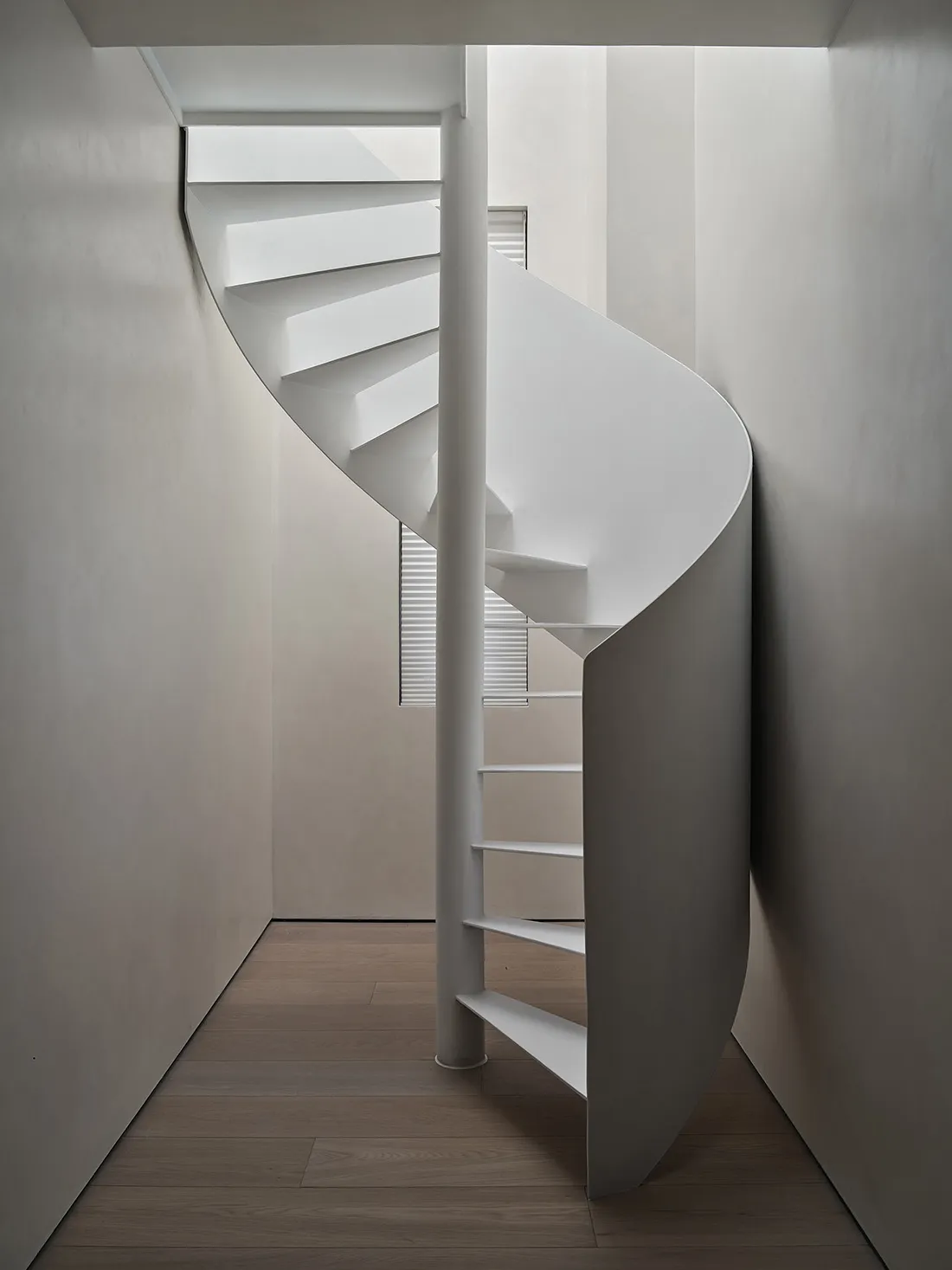 Modern, minimalist white staircase made of metallic material