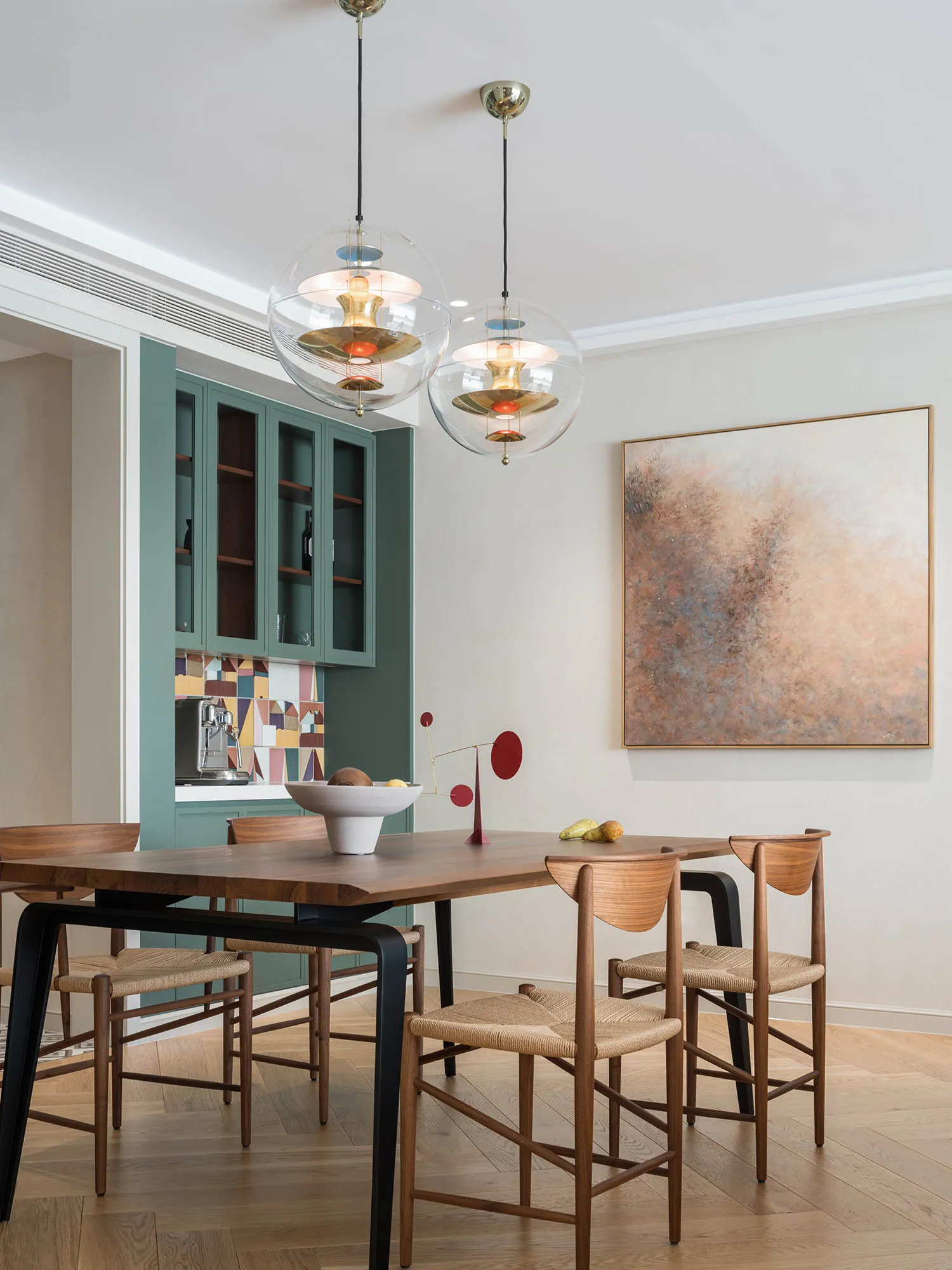 A modern interior design featuring wood, glass, and metal elements.