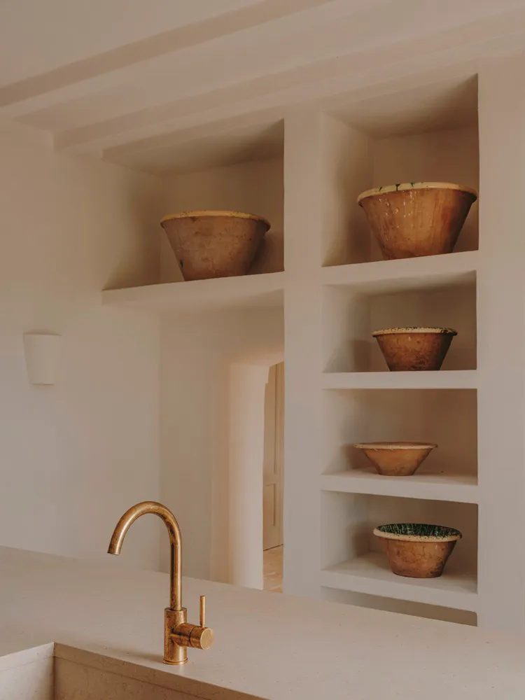 Modern minimalist kitchen with ceramic bowls and wooden accents
