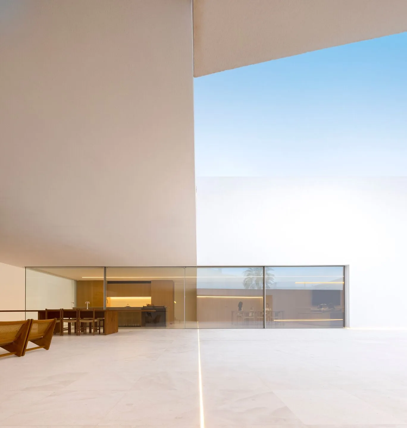 Modern interior design featuring glass and concrete materials.