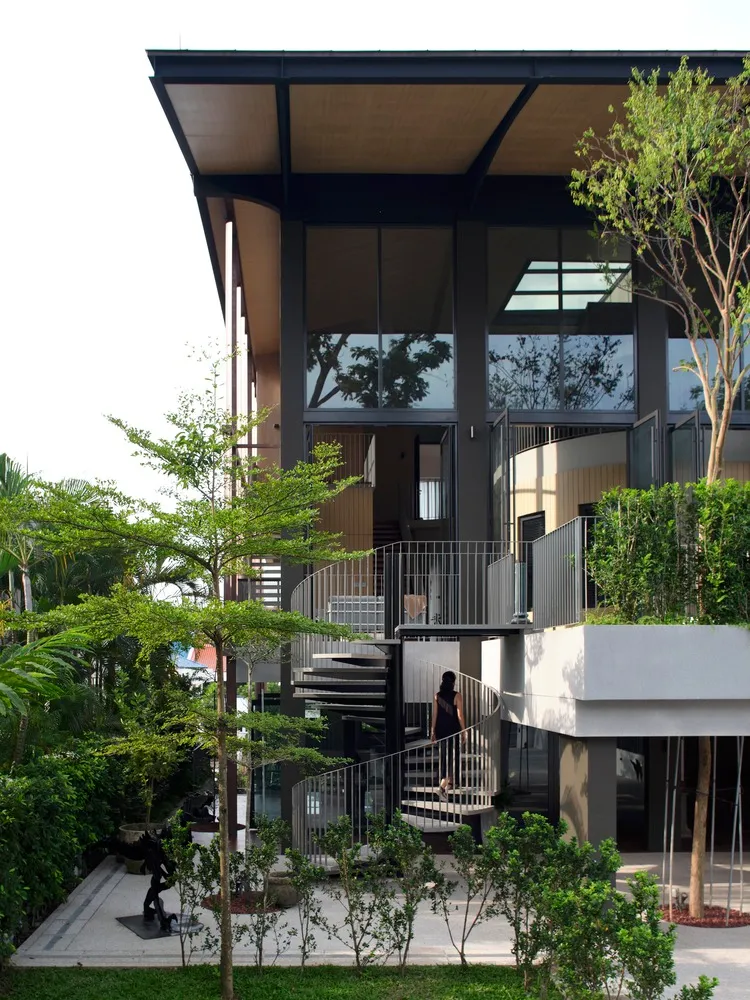 A modern residential building with a glass and concrete exterior