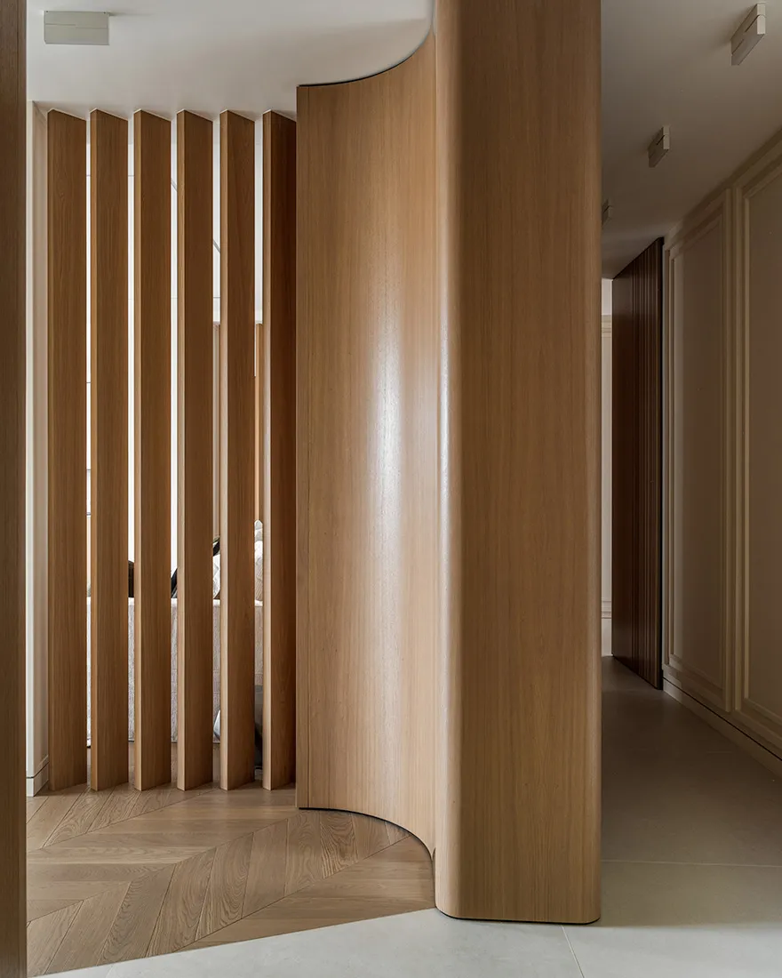 Modern interior design featuring a wooden, curved screen partition.