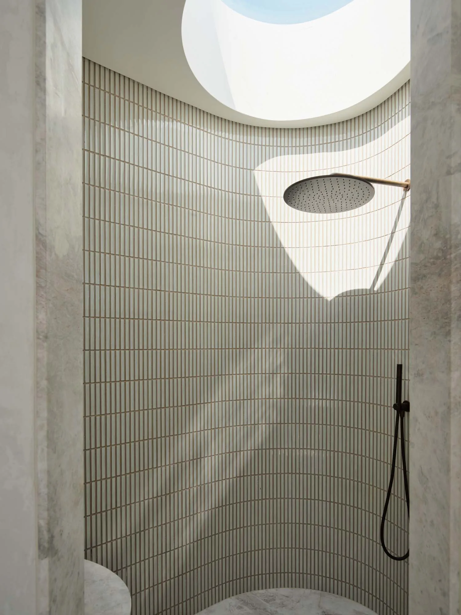 Modern bathroom with marble and glass materials