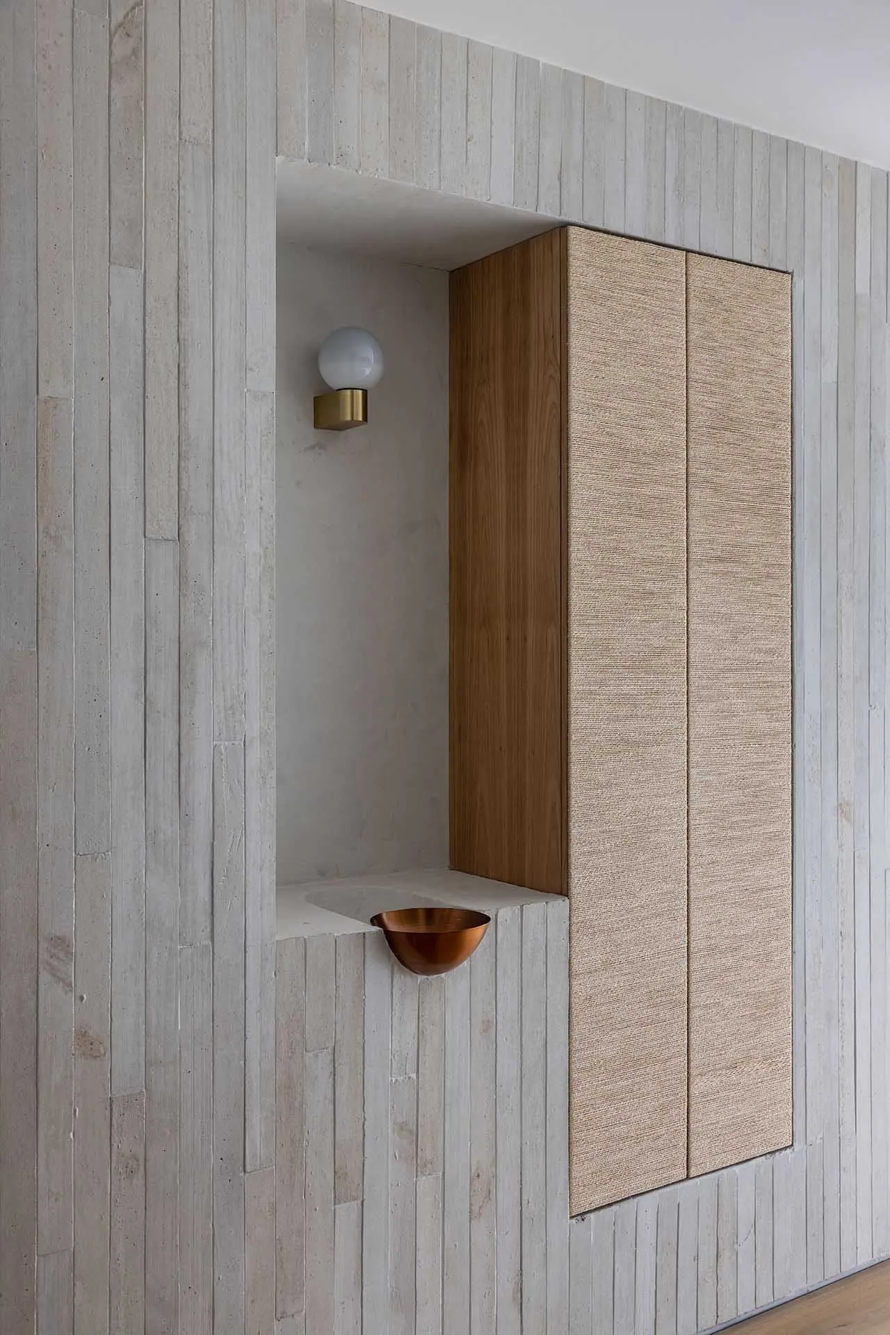 Modern industrial-style corner cabinet featuring a concrete finish, designed with minimalist aesthetic and functional storage