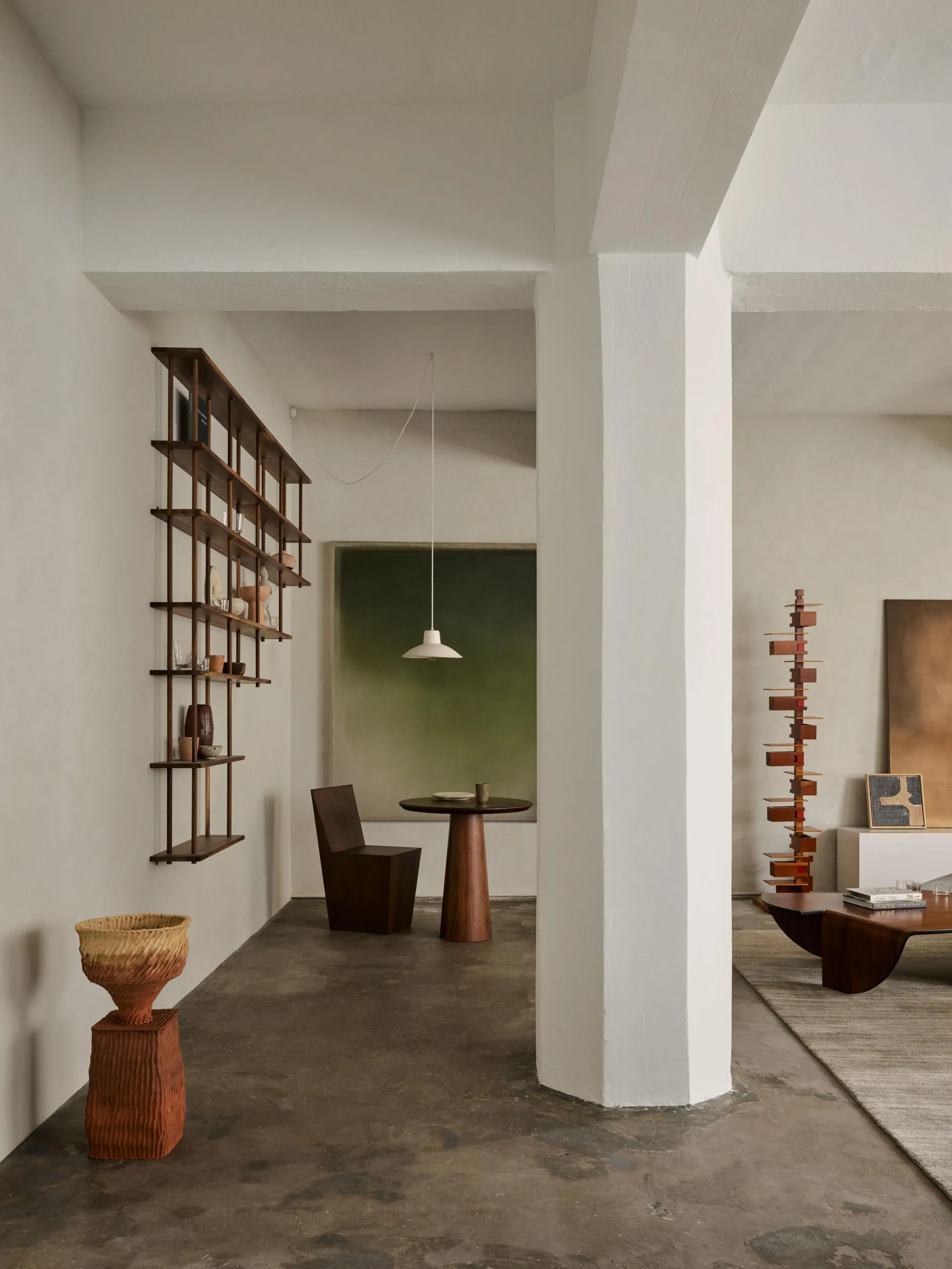 A modern living room featuring wood and concrete elements.