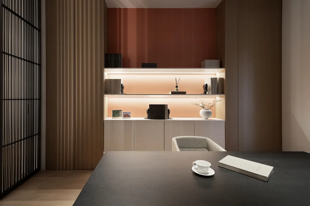 A modern minimalist home office with light-colored wood accents.