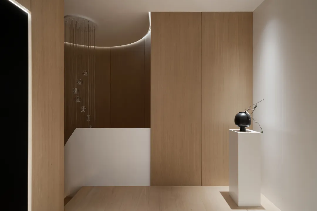 A minimalist interior design featuring wood elements.