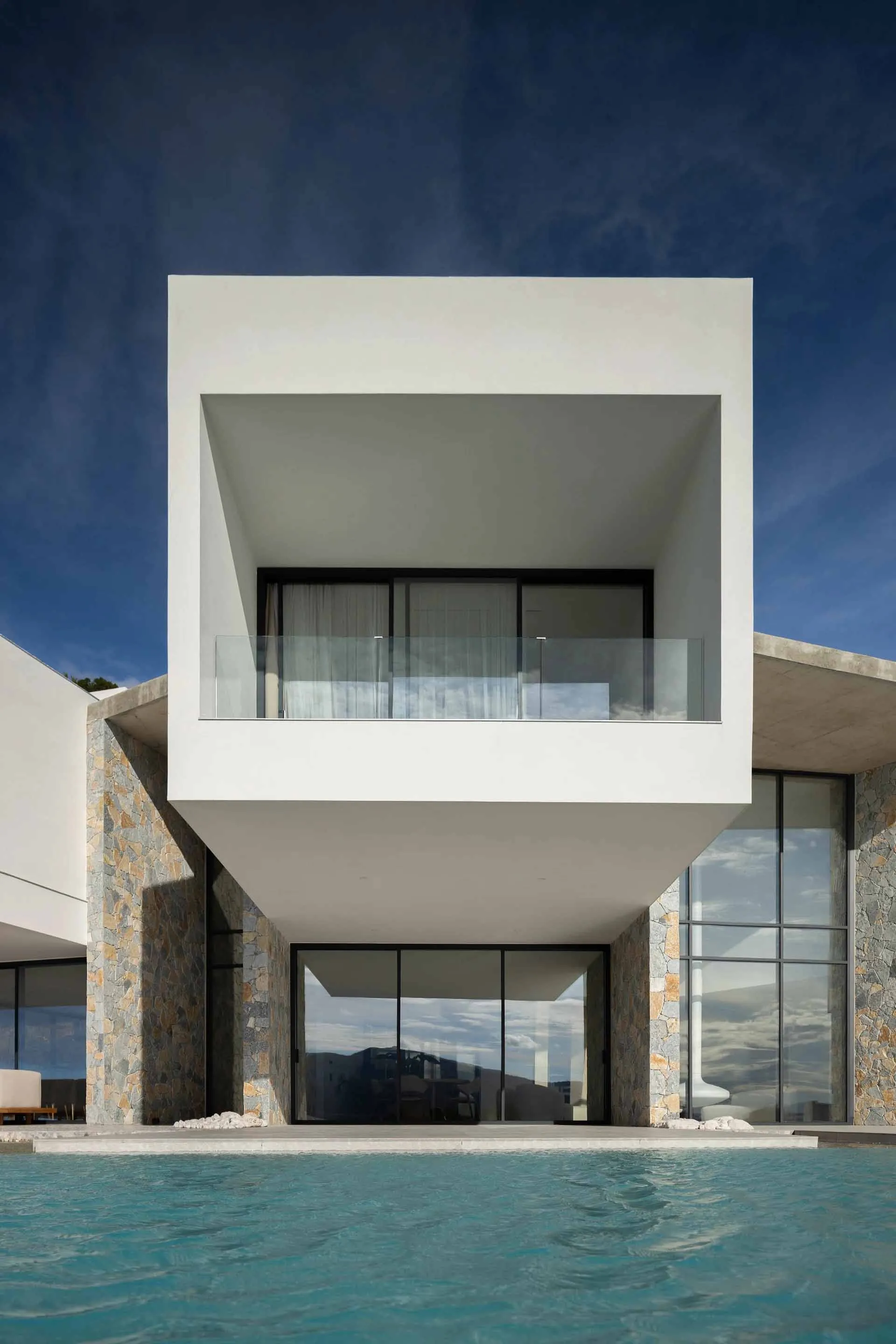 Modern residential architecture with concrete and glass materials.