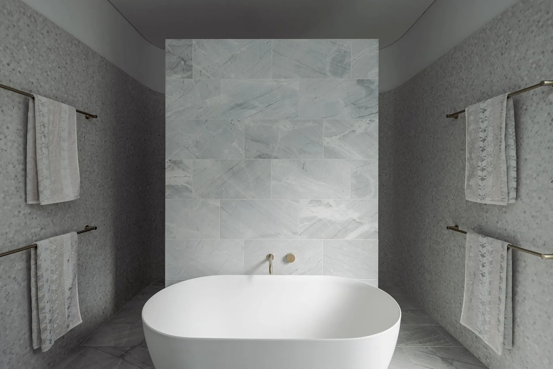 Modern bathroom with marble tiles, showcasing sleek and elegant design.