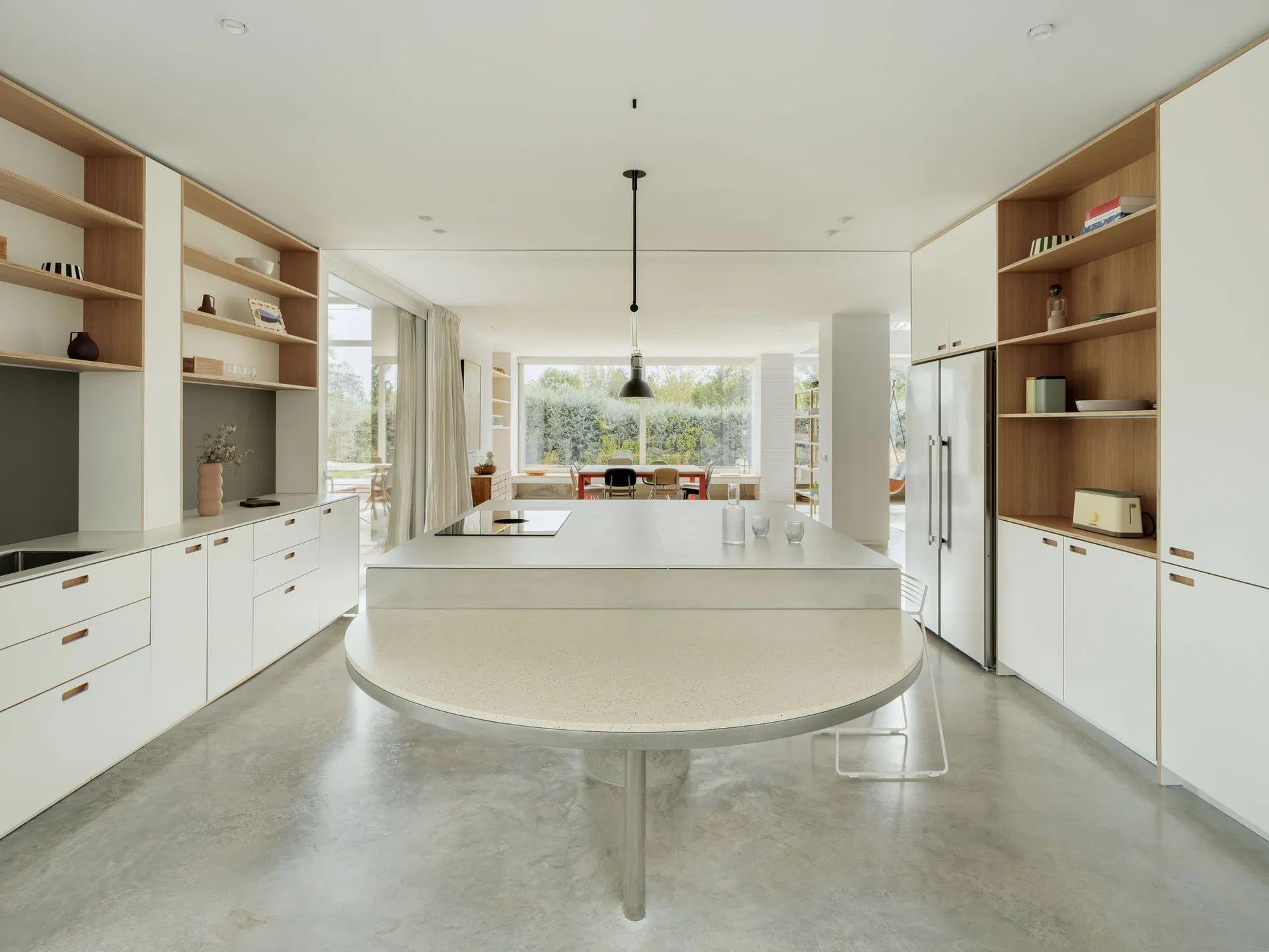 Modern minimalist retail storefront featuring a concrete floor plan and minimalist design elements.
