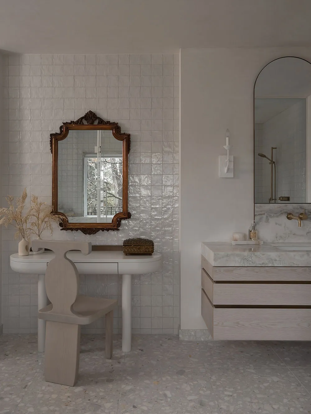 Modern bathroom with terrazzo floor, white walls, and minimalist design.