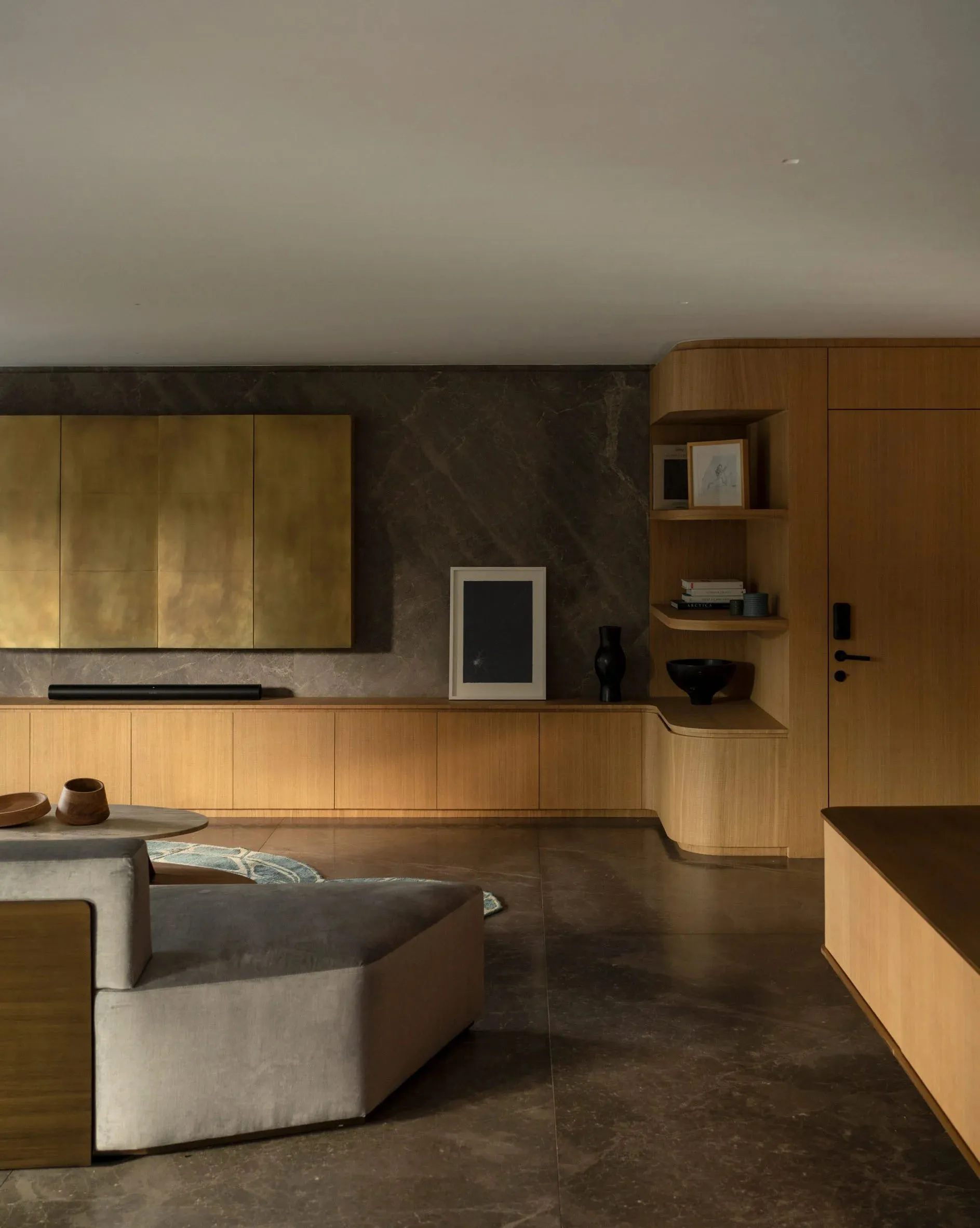 Modern living room featuring a marble countertop, sleek furniture, and a contemporary design aesthetic.