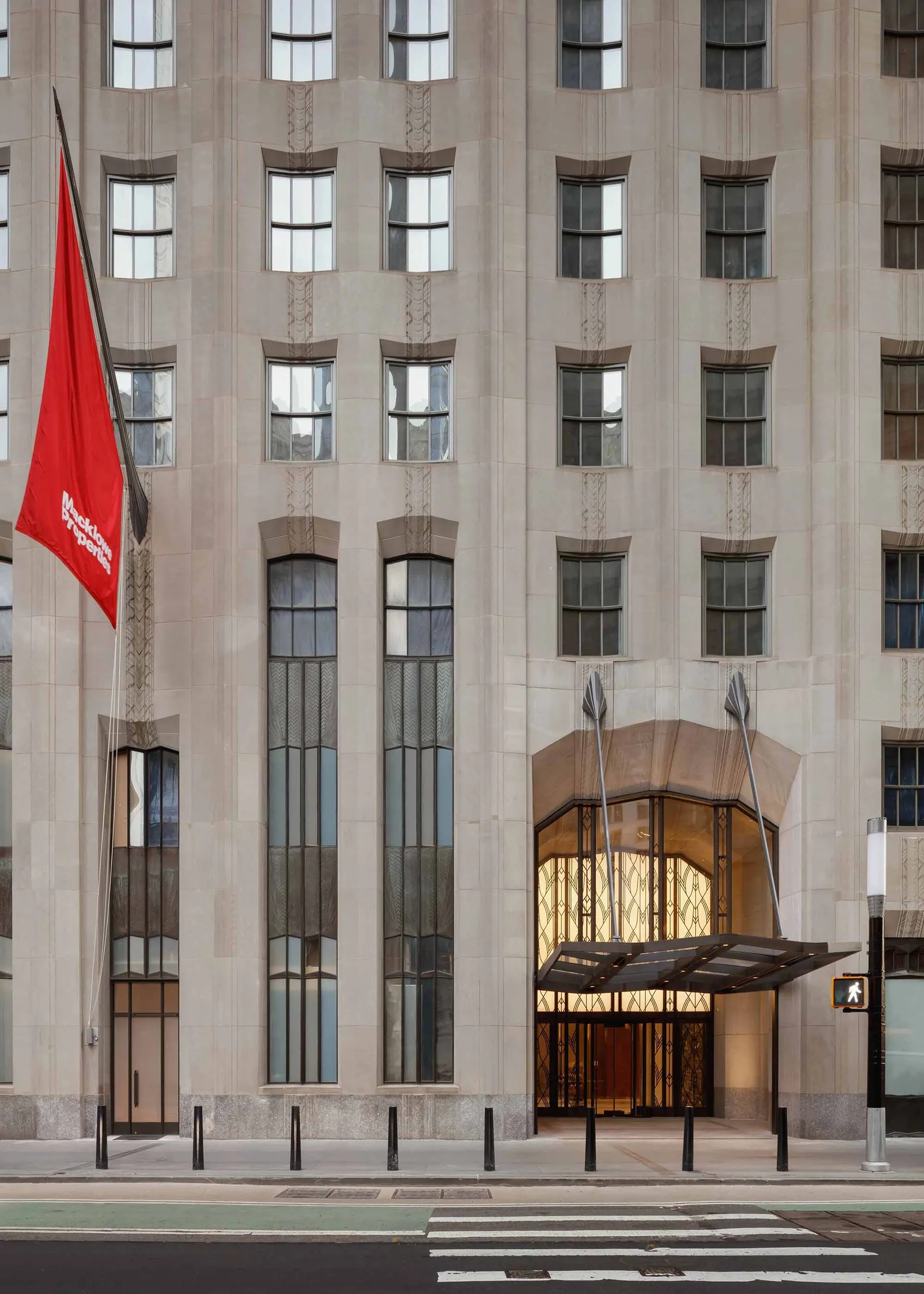 Concrete and glass entryway of an office building.