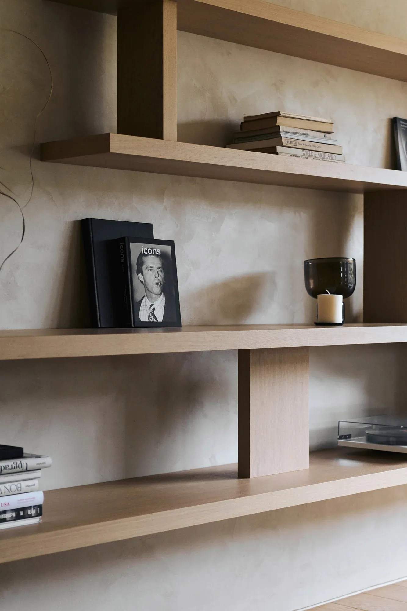 A stylish, modern interior shelf display featuring wood materials, showcasing design elements and organization.