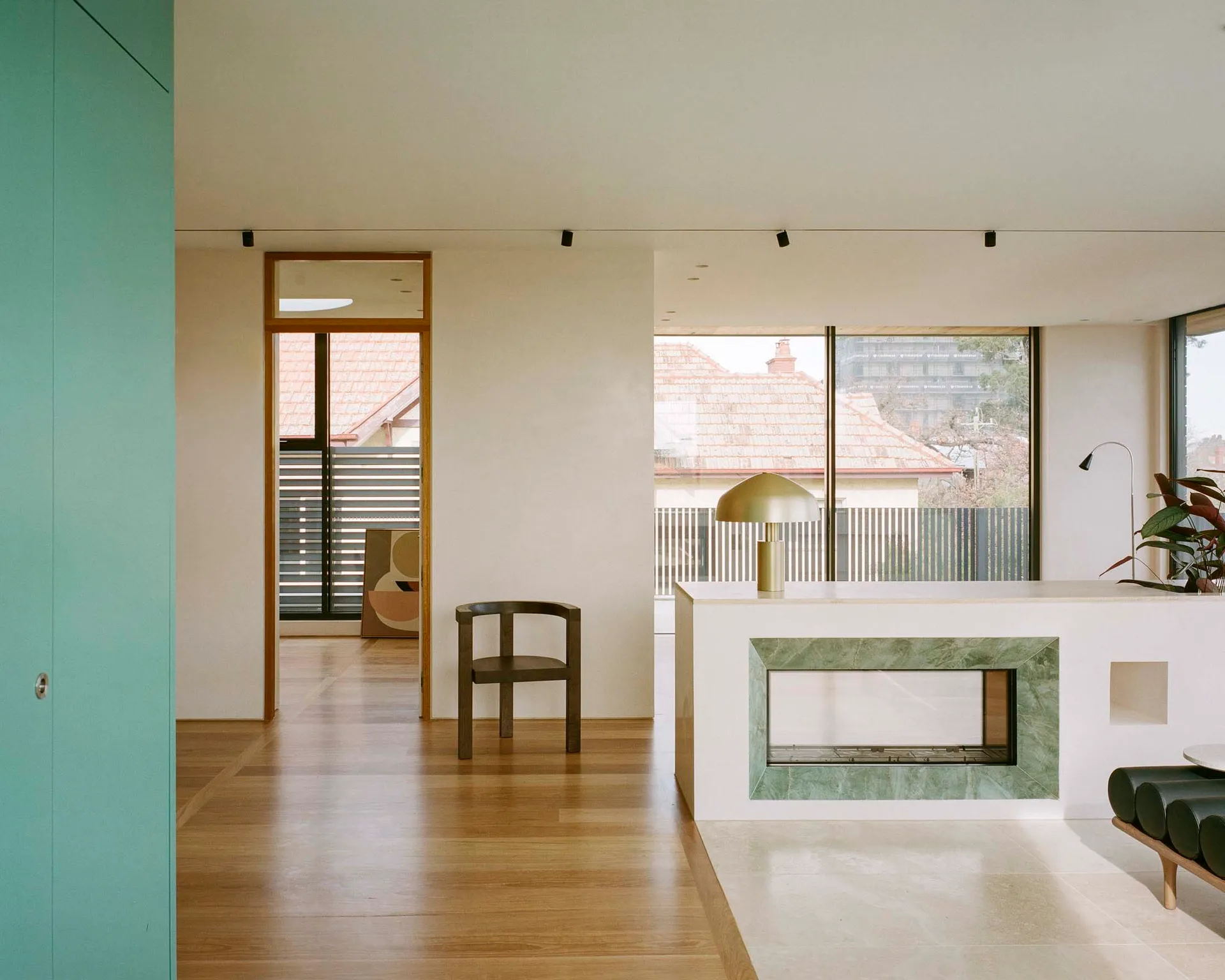 A minimalist living room featuring marble elements.