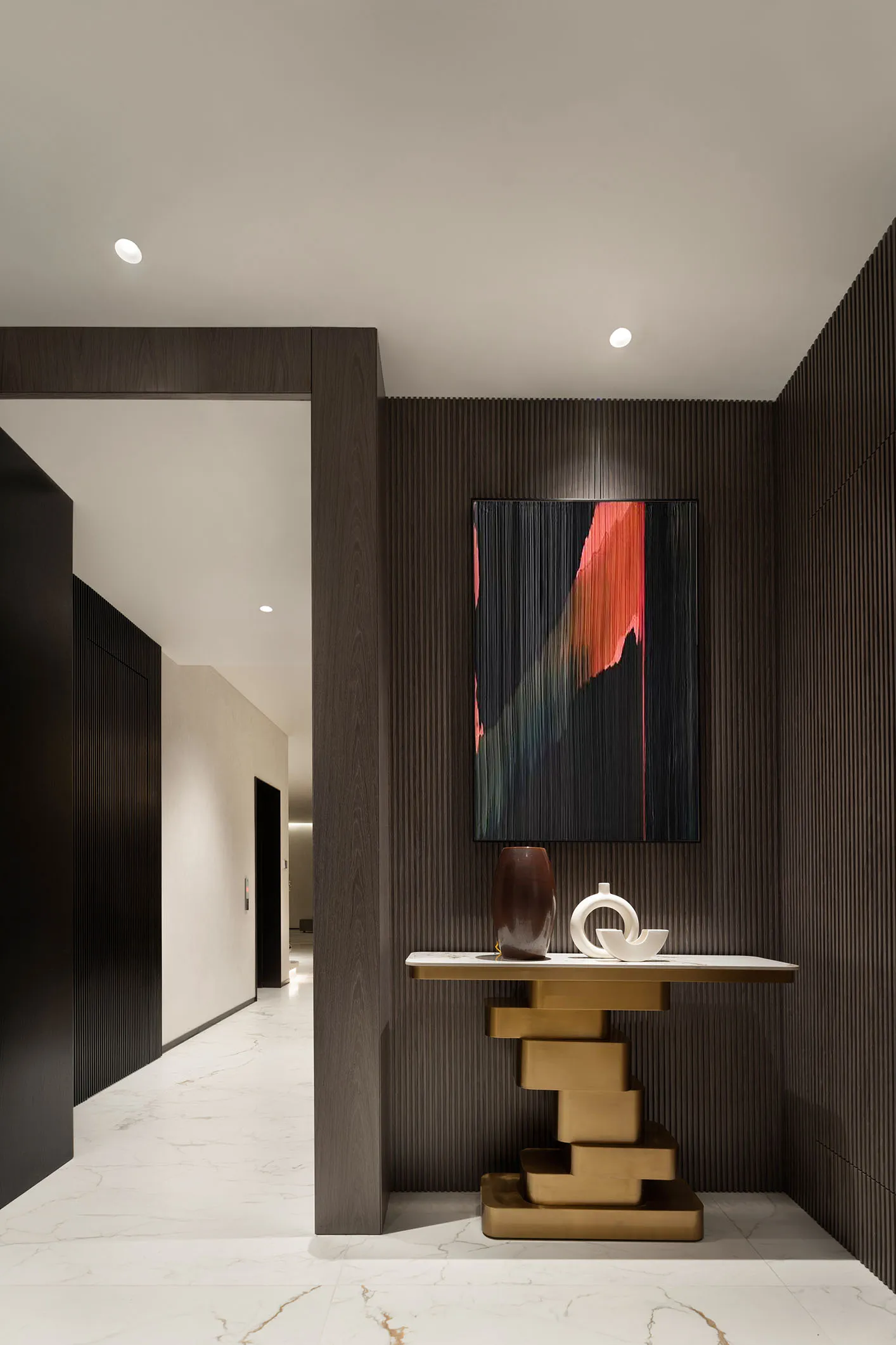 Modern entrance hall featuring dark wood walls and ceiling with minimalist design elements.