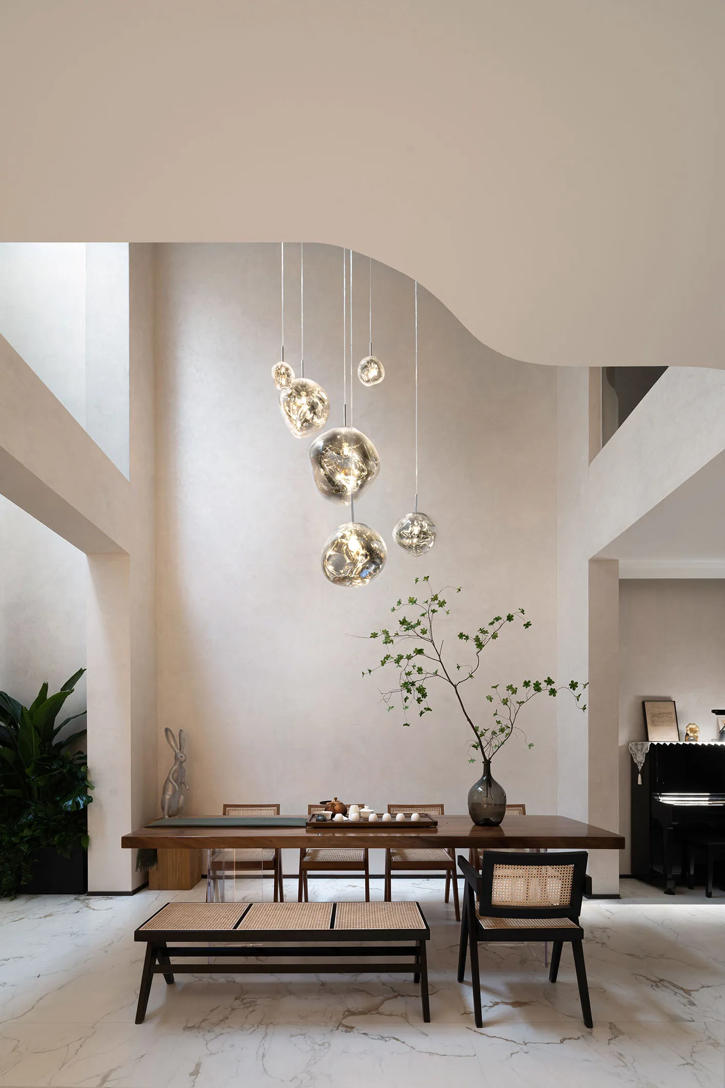Modern living room featuring wooden furniture, lights, and plants