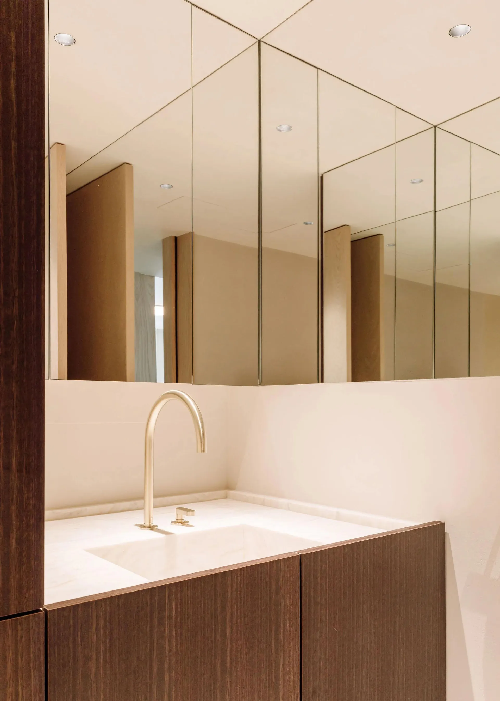Modern minimalist bathroom featuring marble sink and countertop.