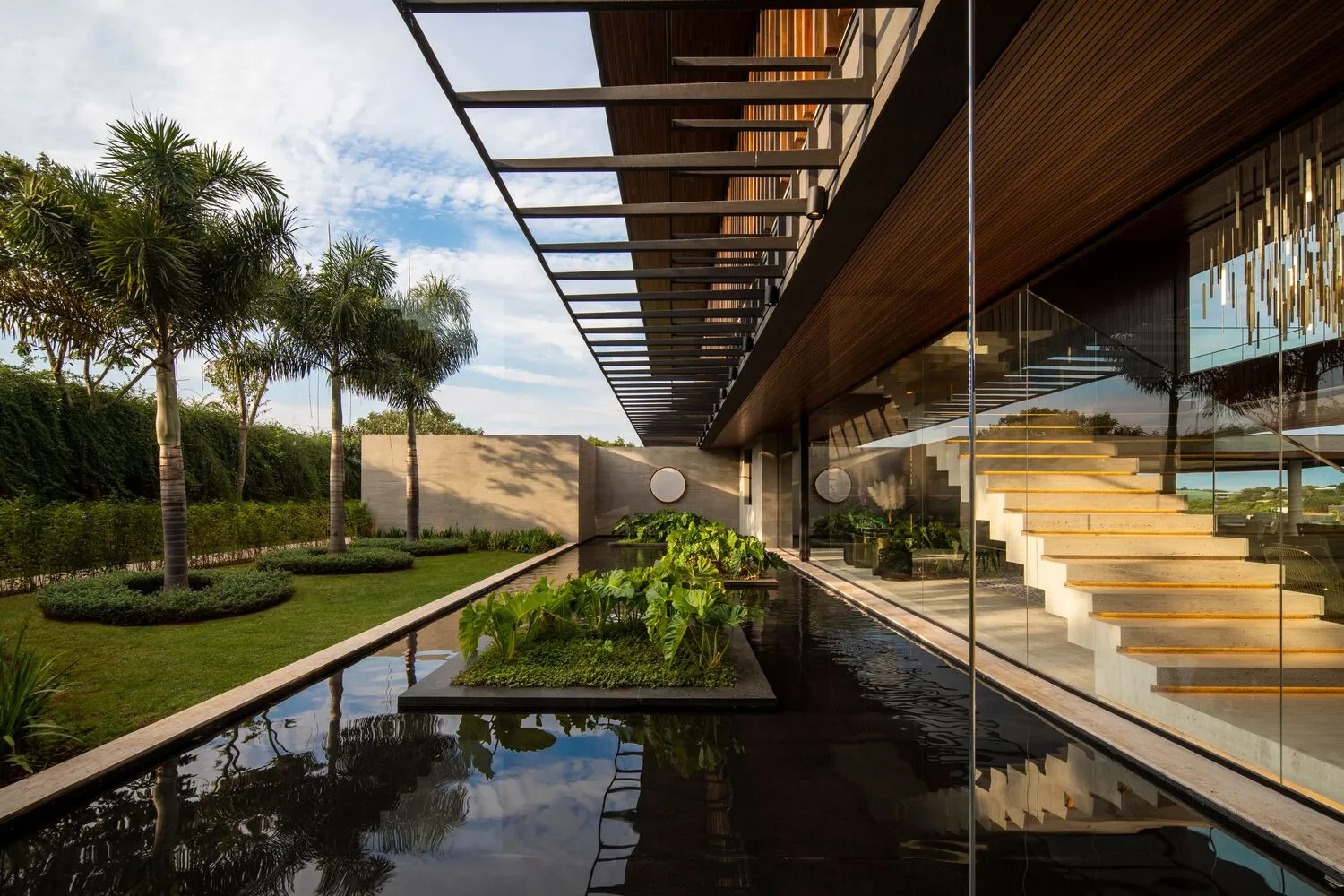 Modern residential house exterior with concrete and glass materials.