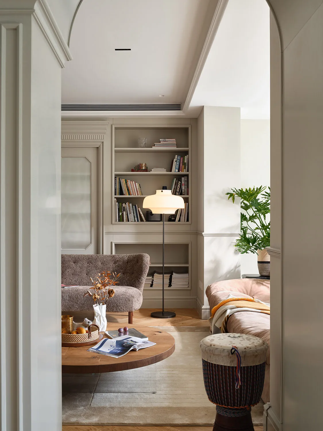 Modern living room with hardwood flooring, comfortable seating, and a cozy ambiance.