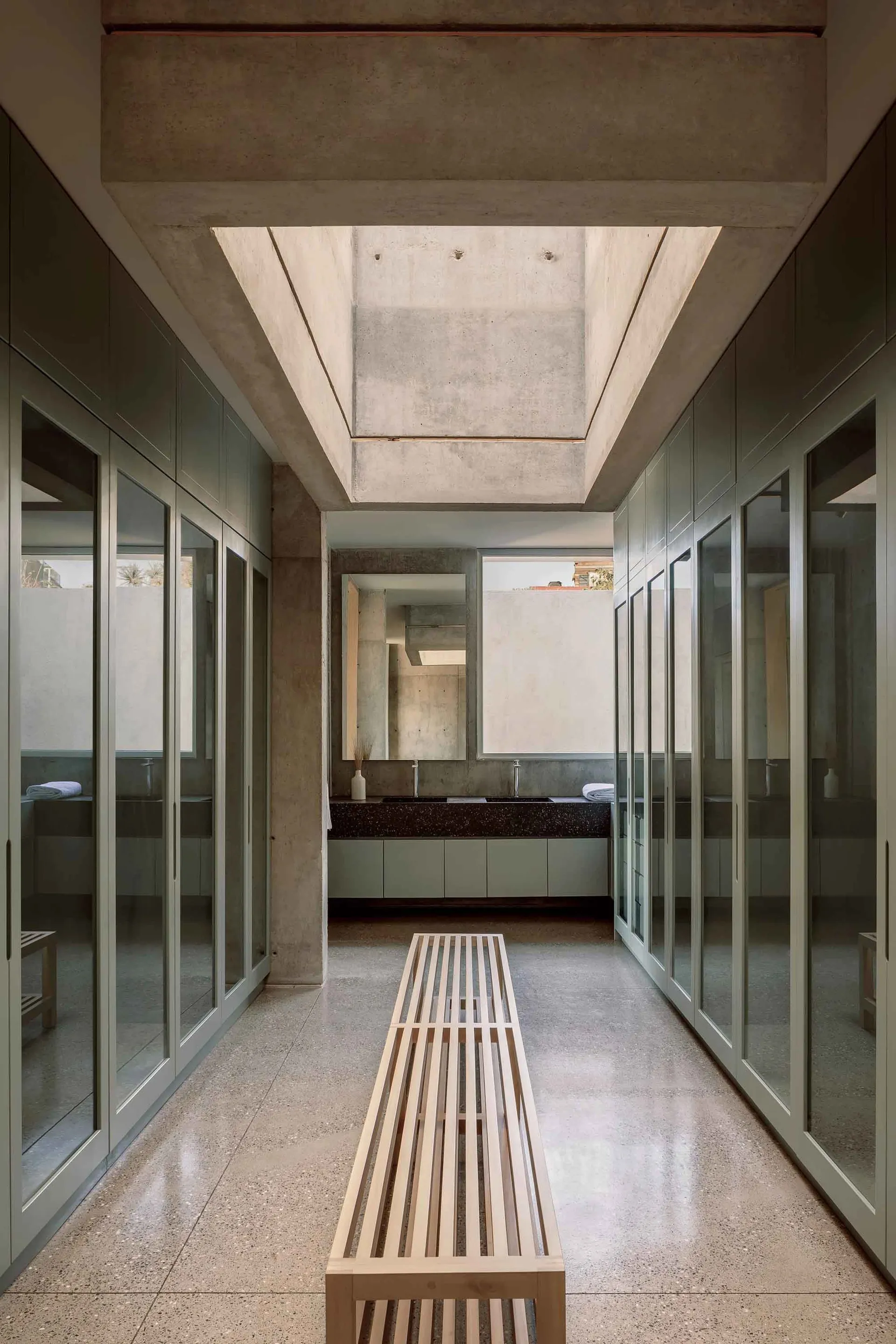 Modern bathroom with concrete and glass elements
