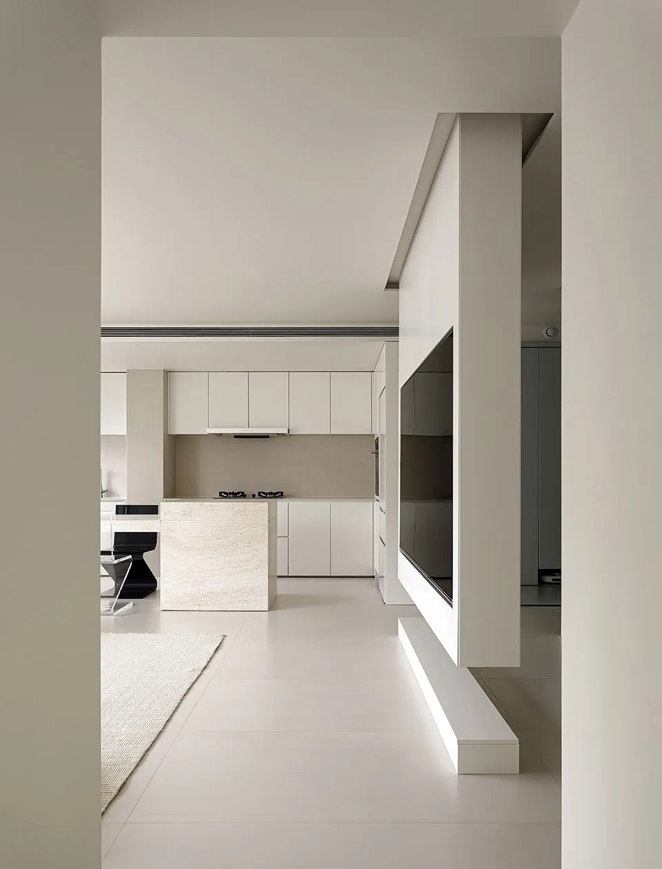 Modern kitchen with white marble island and white cabinets