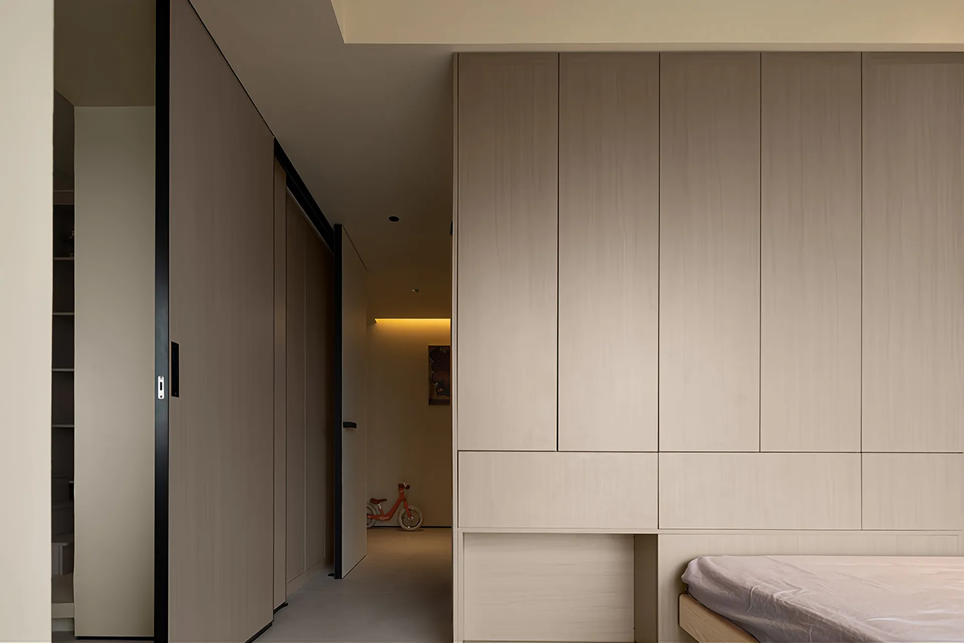 Modern bedroom with minimalist design, featuring wood paneling and a sleek, contemporary style.
