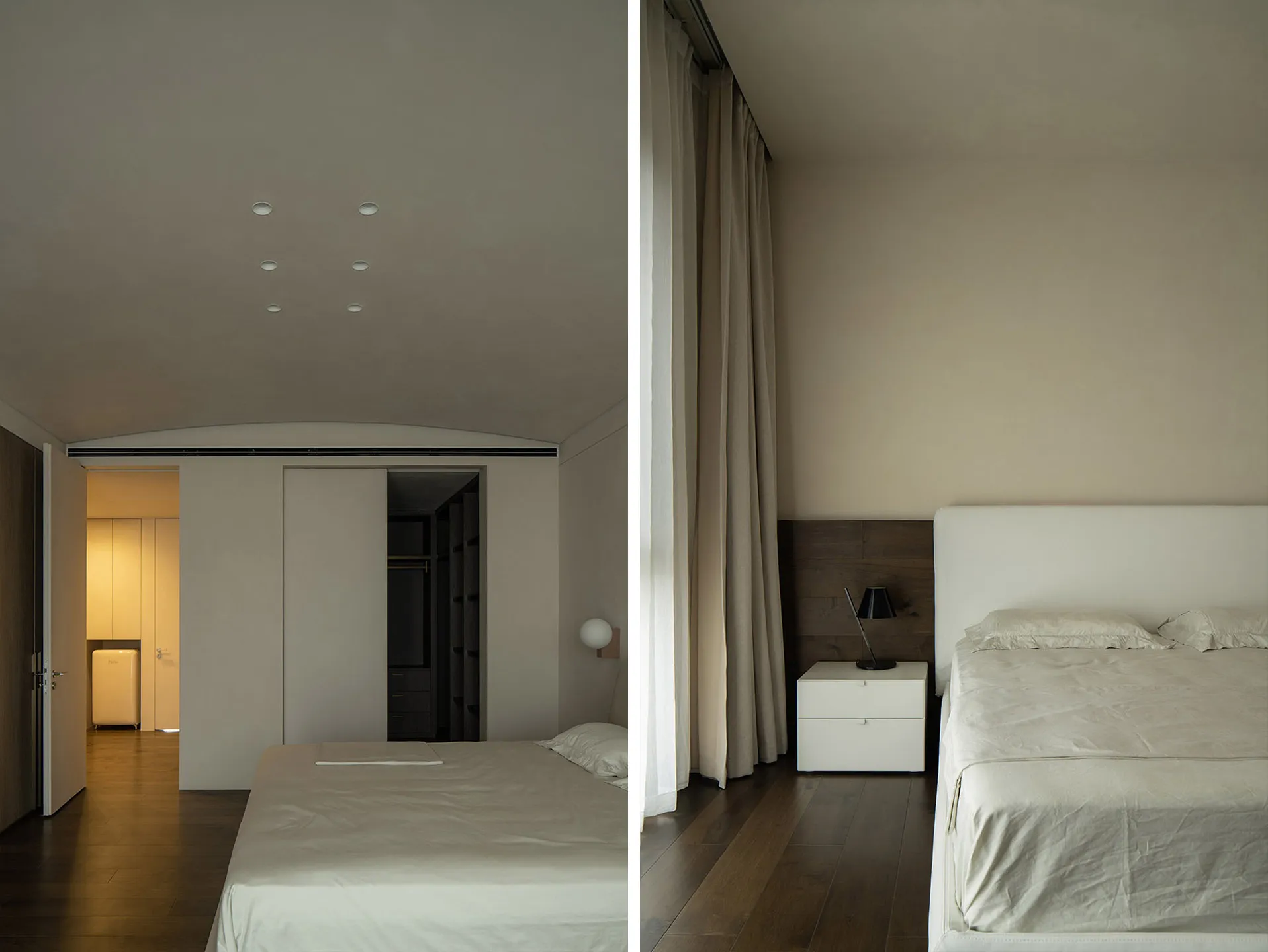 Modern minimalist bedroom with white beds and curtains, wooden flooring.