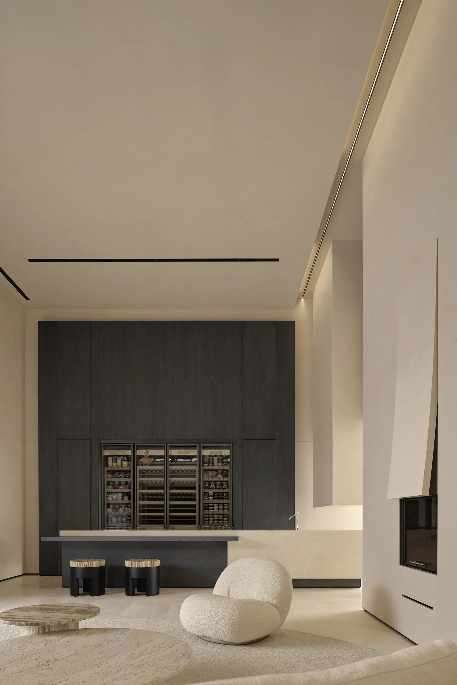 A minimalist spa interior featuring sleek concrete walls and furniture.