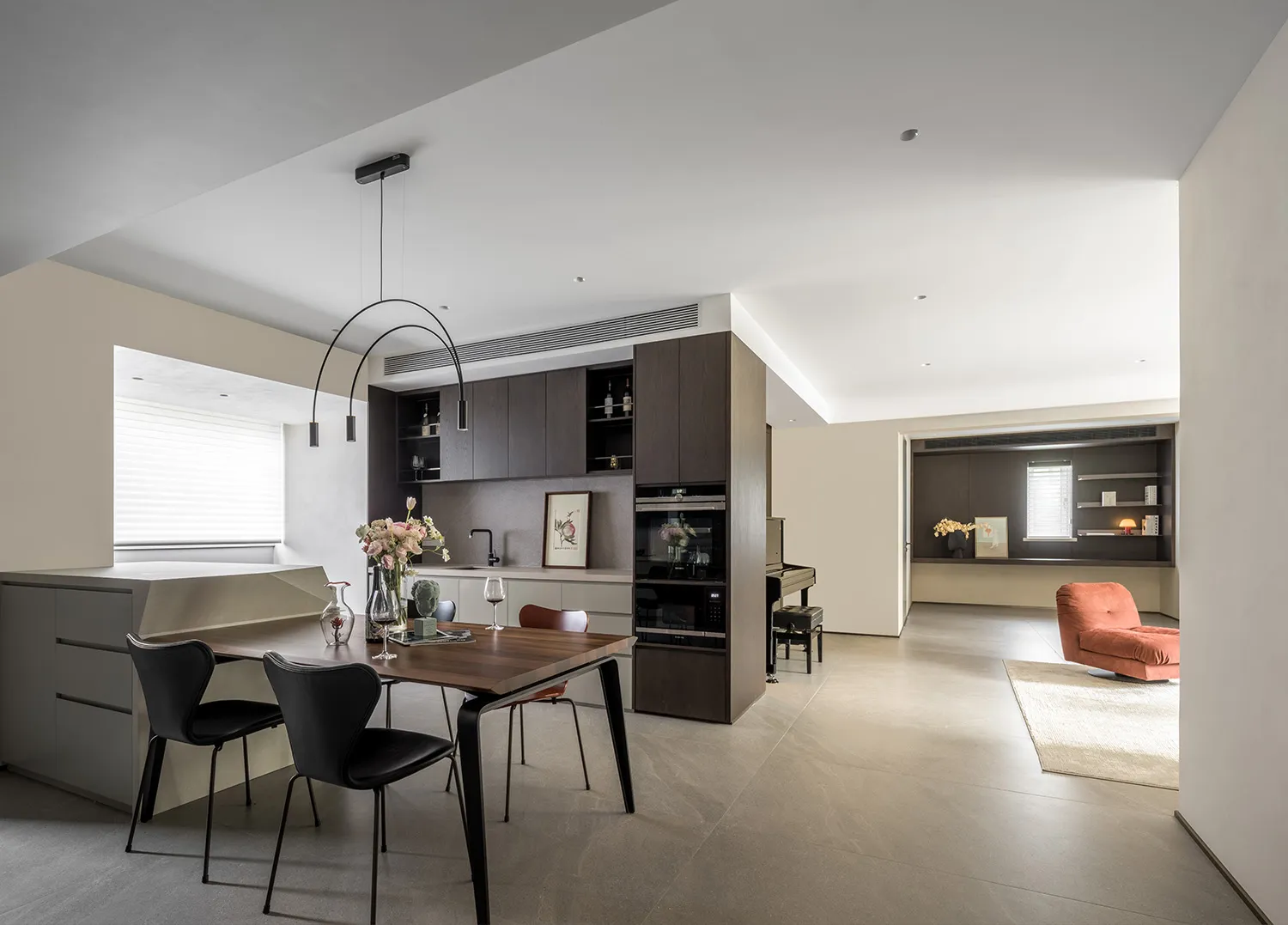 A modern apartment featuring concrete flooring and minimalist design.
