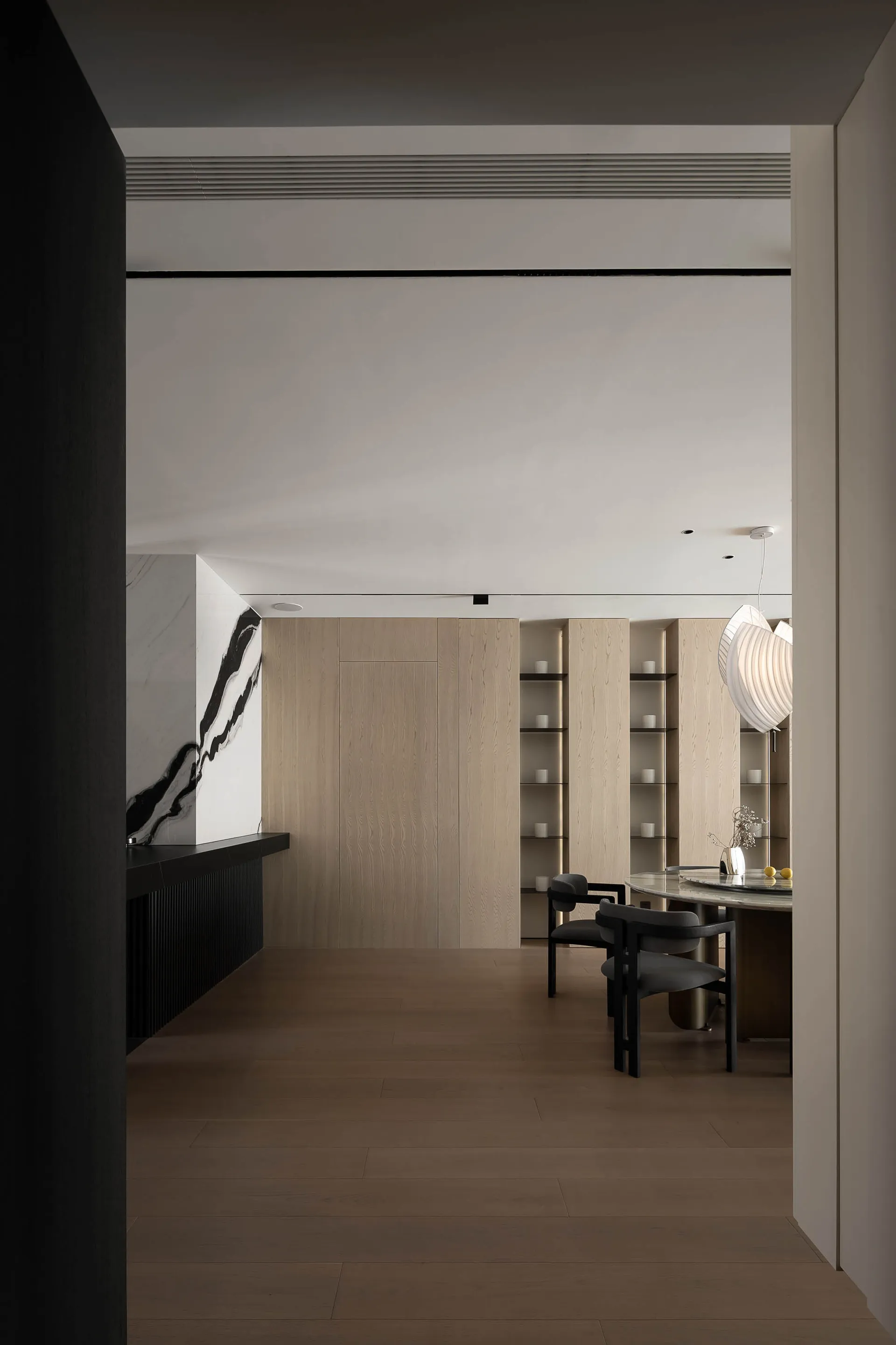 A modern interior featuring wood and marble materials