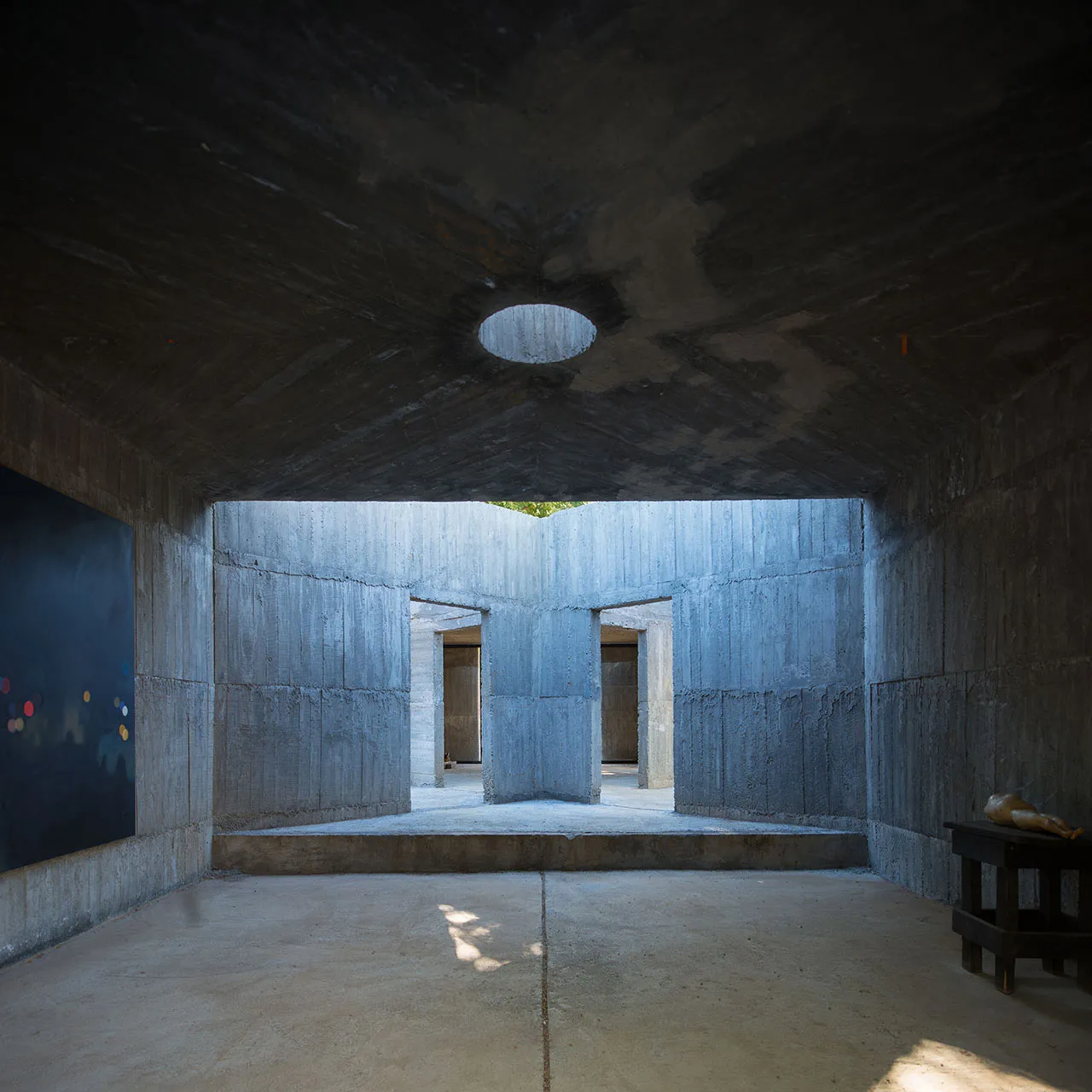 A minimalist concrete interior space with an abstract spatial composition.