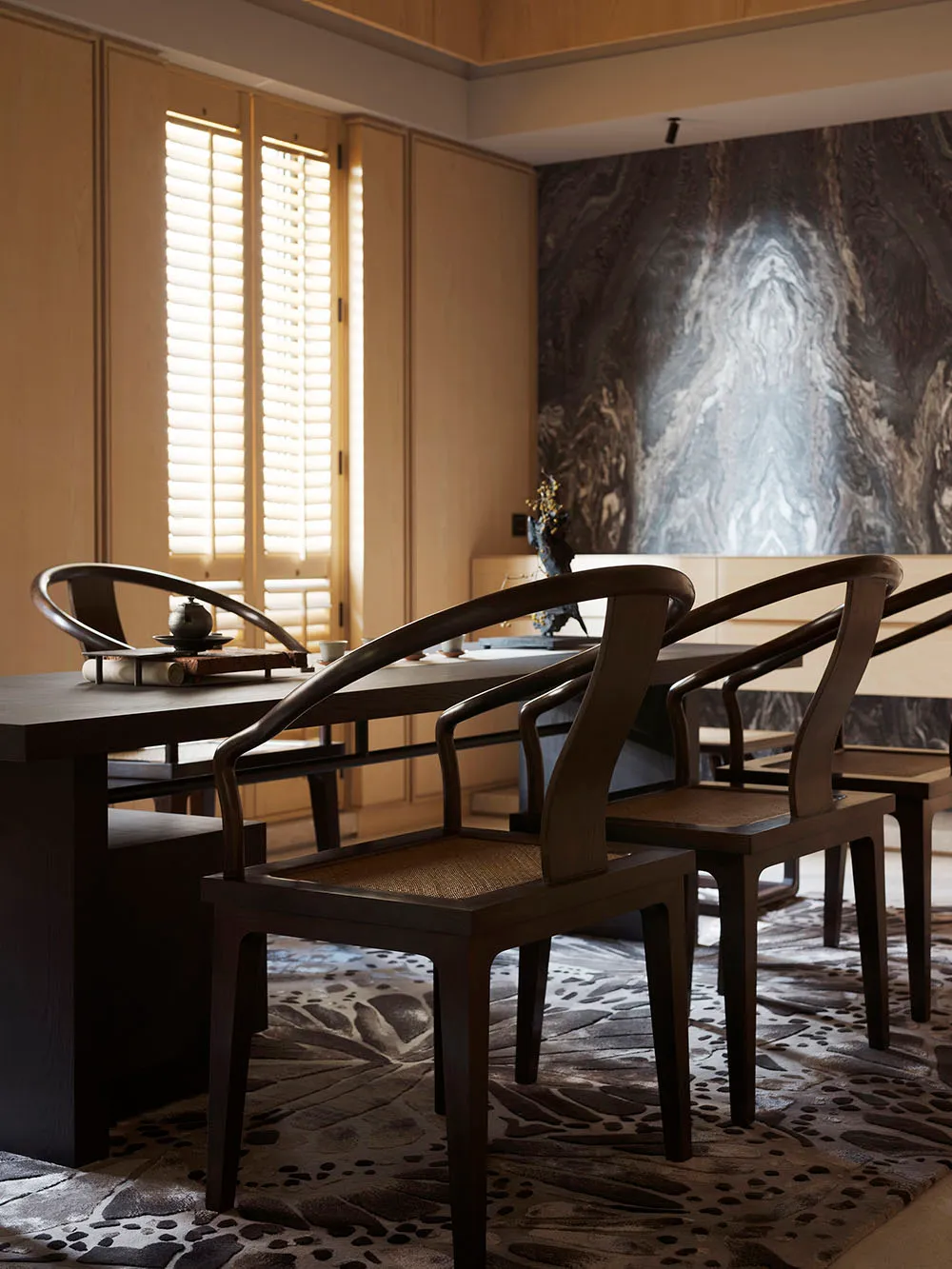 A modern dining room featuring wooden furniture with a contemporary design.