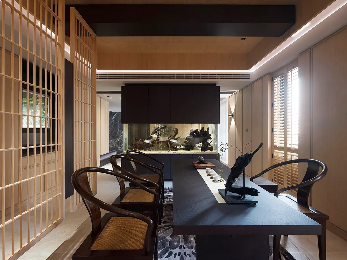 Modern living room featuring wooden furniture and a fish tank