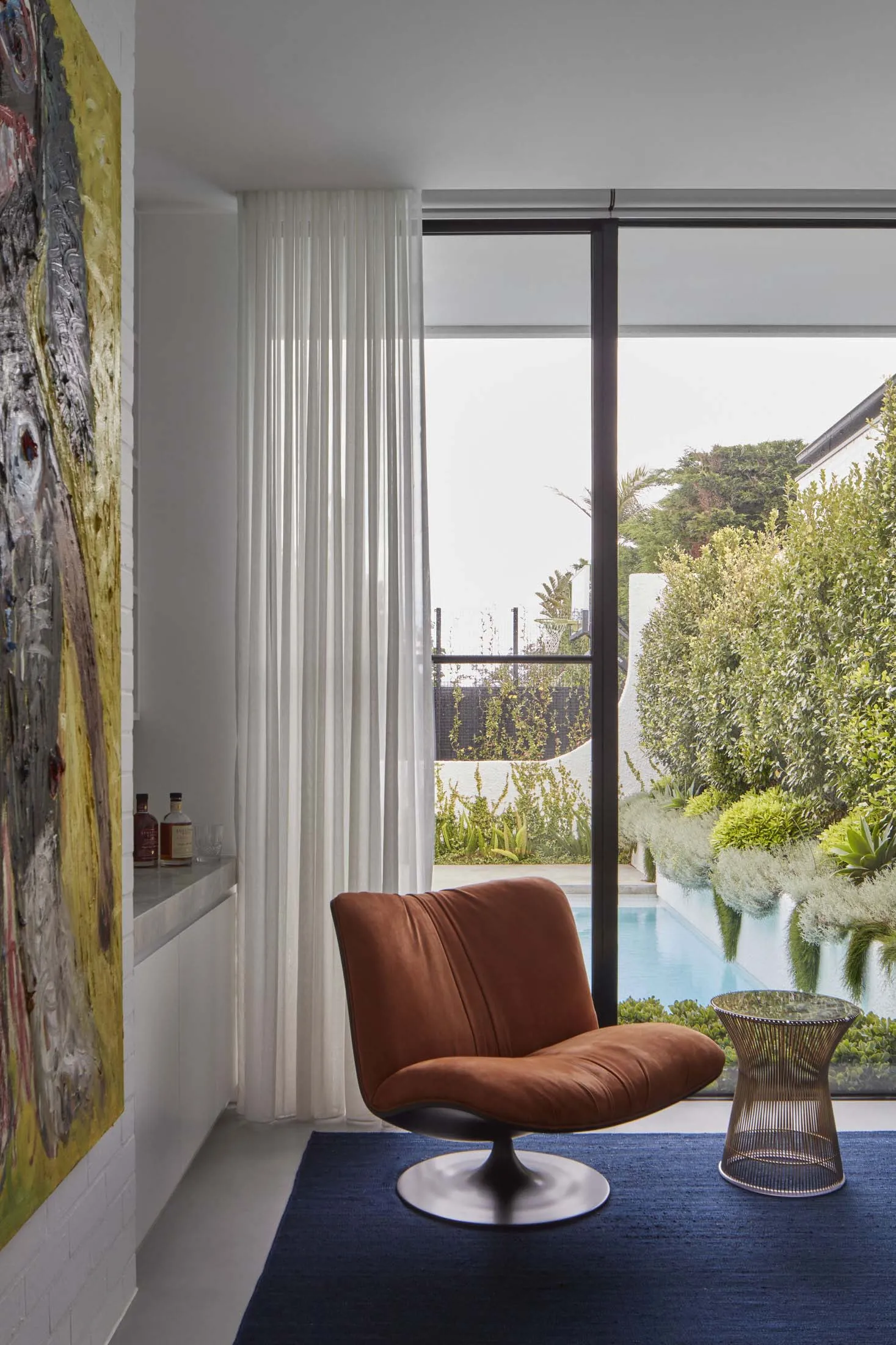 Modern interior design featuring a comfortable leather armchair in a living room setting.