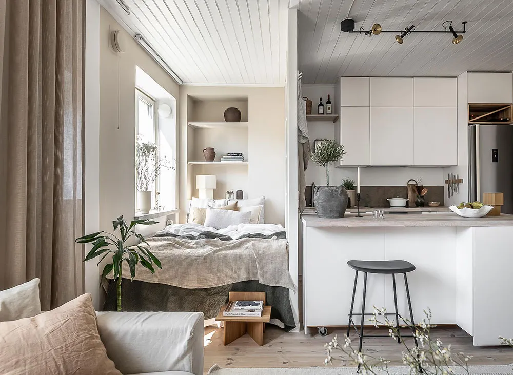 A minimalist apartment with neutral tones and modern furniture.