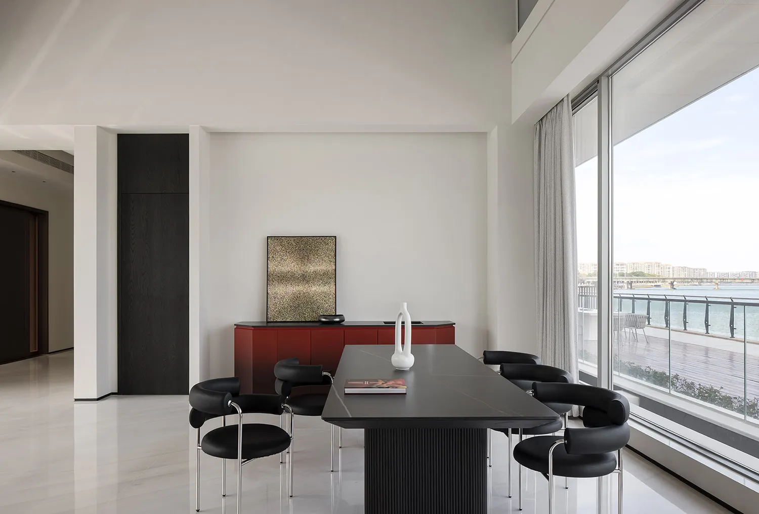 A modern residential interior with metal, glass, and ceramic materials.