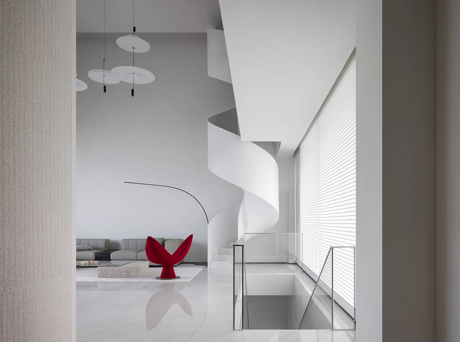 A minimalist interior design featuring a white marble staircase.