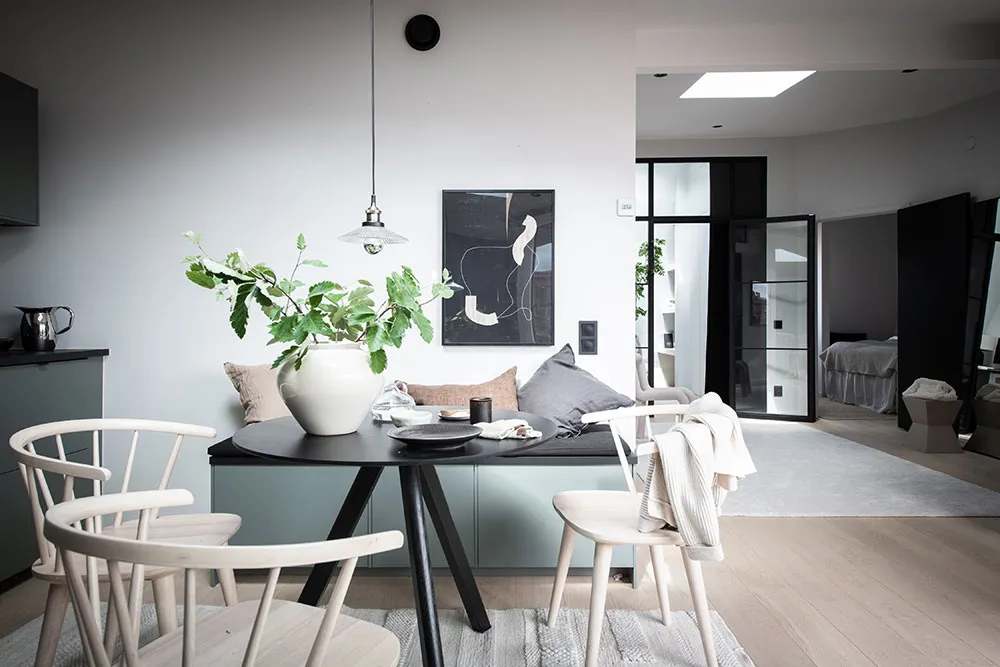 Modern dining room with white furniture and minimalist decor