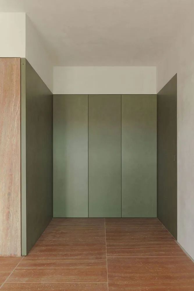 A minimalist interior with metallic walls and a minimalist design.