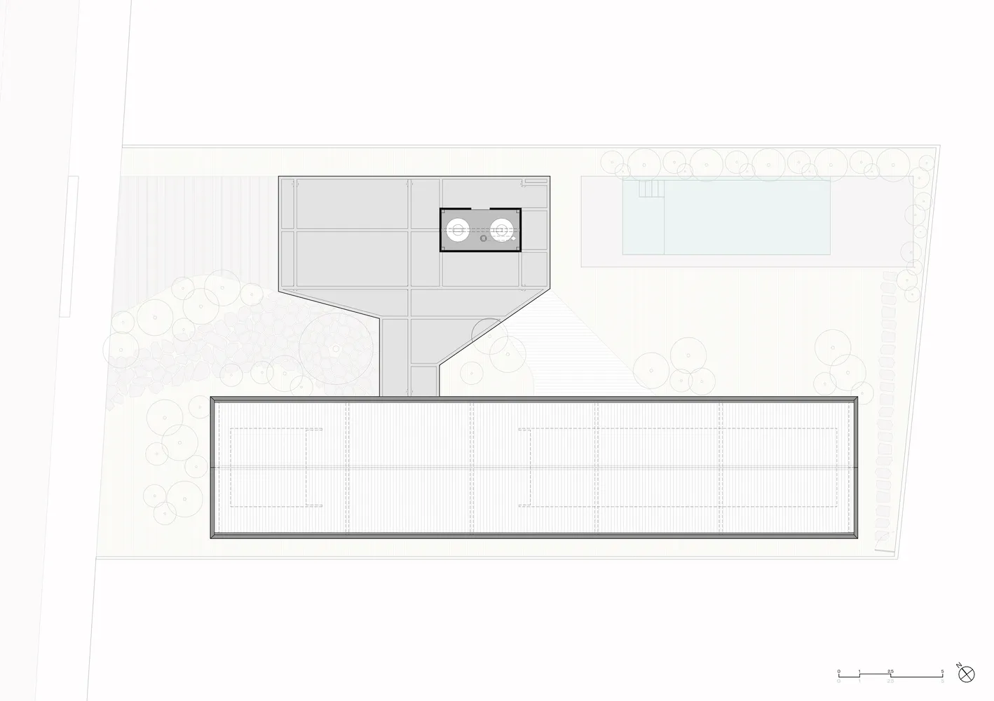 A modern floor plan featuring a concrete structure with a rectangular layout and a central open space.