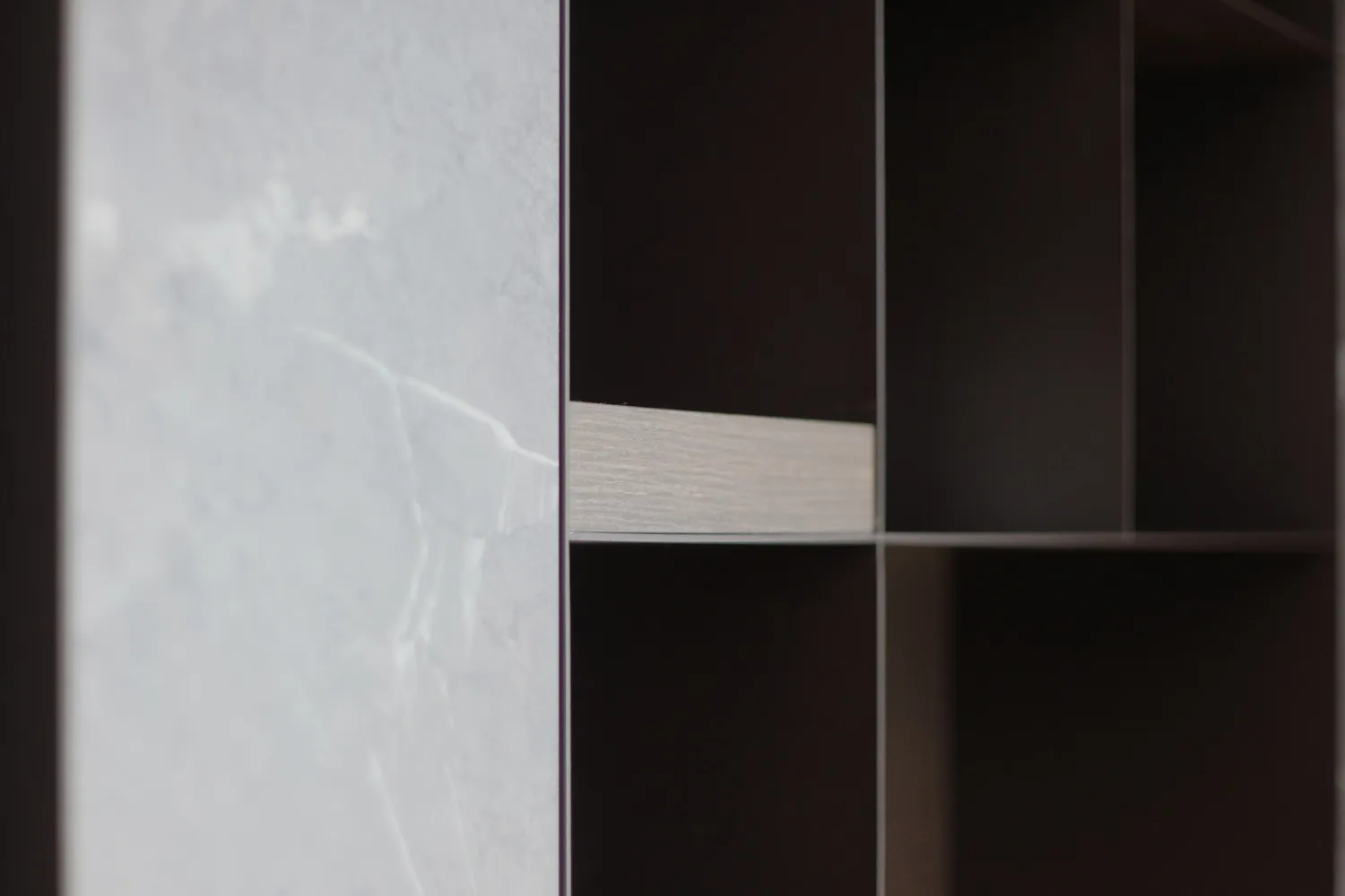 A close-up view of an industrial storage unit designed with a combination of marble and concrete materials.