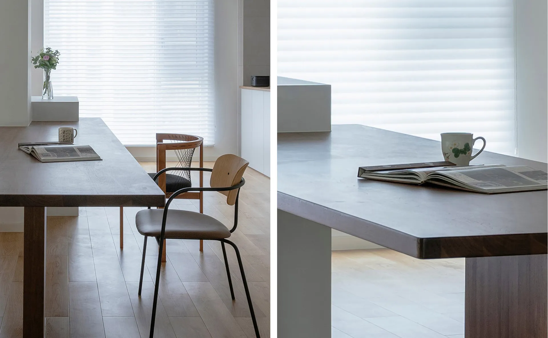 Modern minimalist dining room featuring a long wooden dining table with a concrete countertop, minimalistic furniture, and a