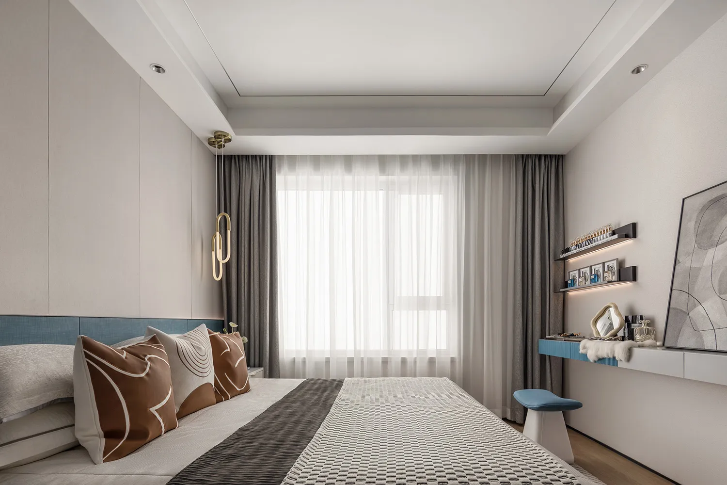 A minimalist bedroom with fabric bedding, wooden headboard, and metallic accents.
