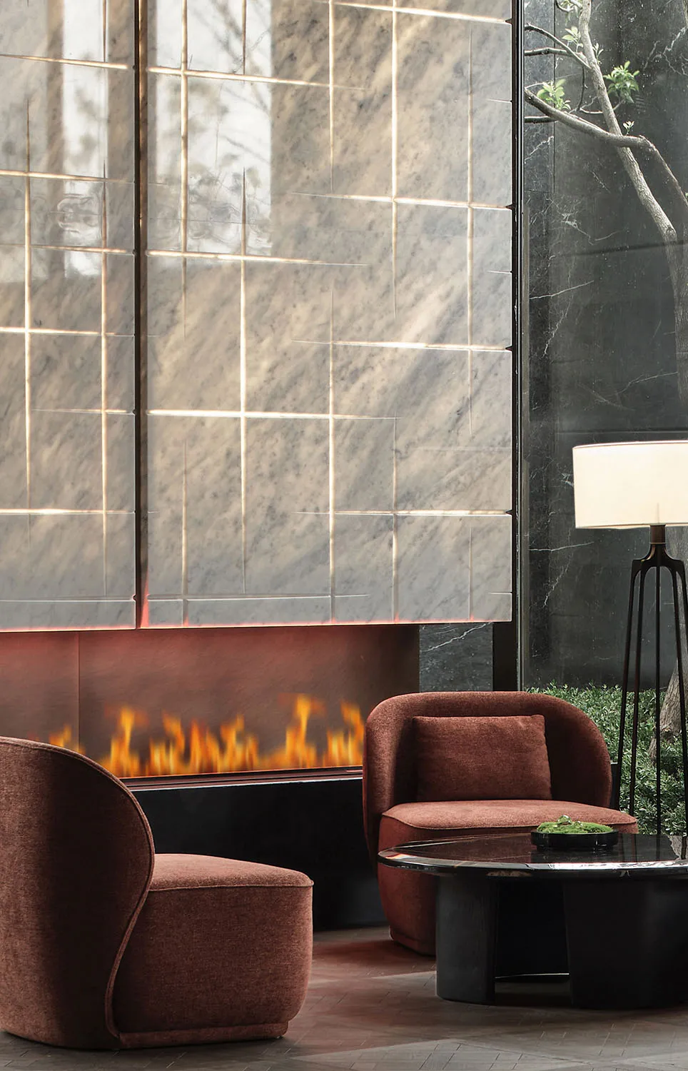 A modern living room with a marble fireplace and brown upholstered chairs.