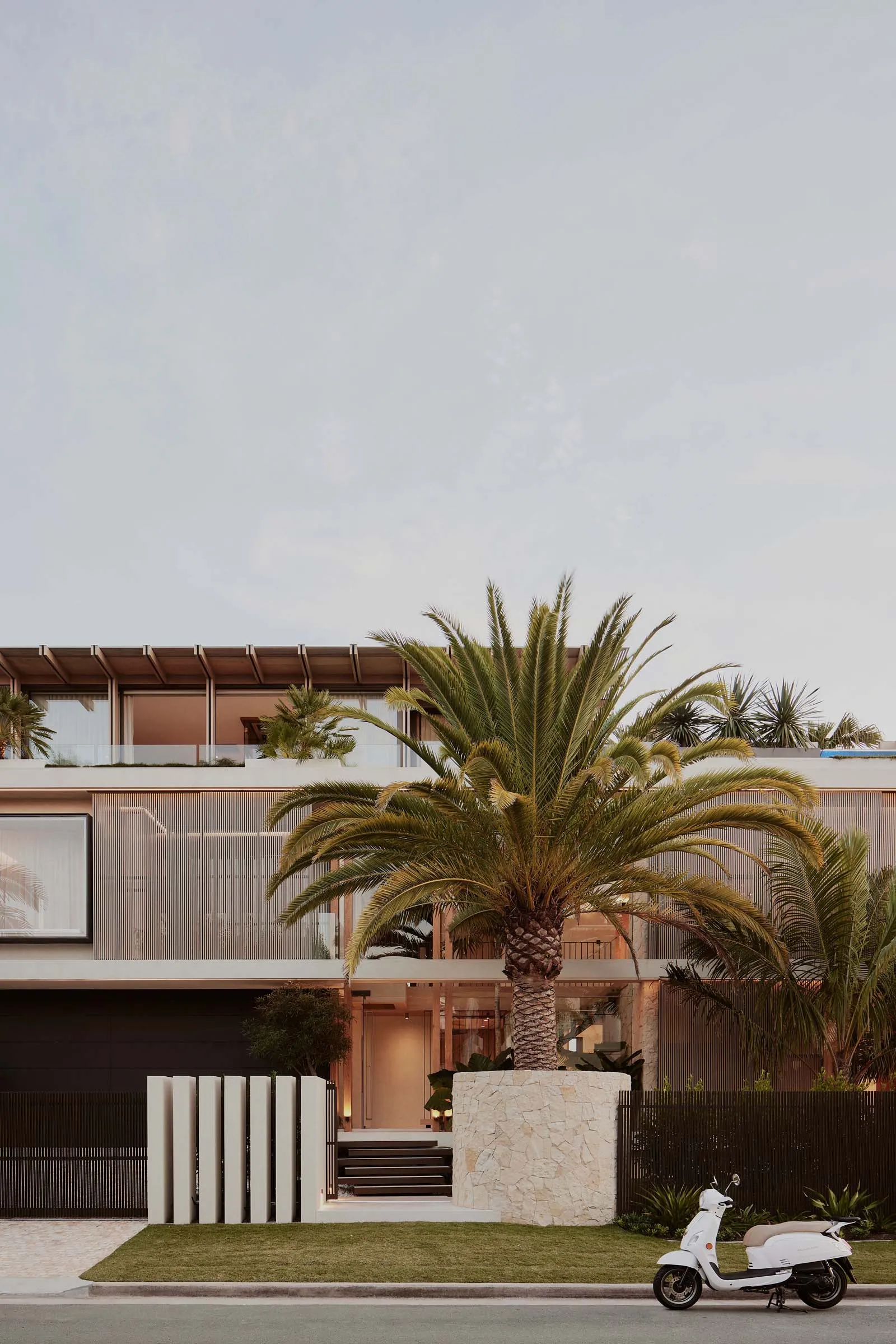 Modern house with concrete and glass exterior features.